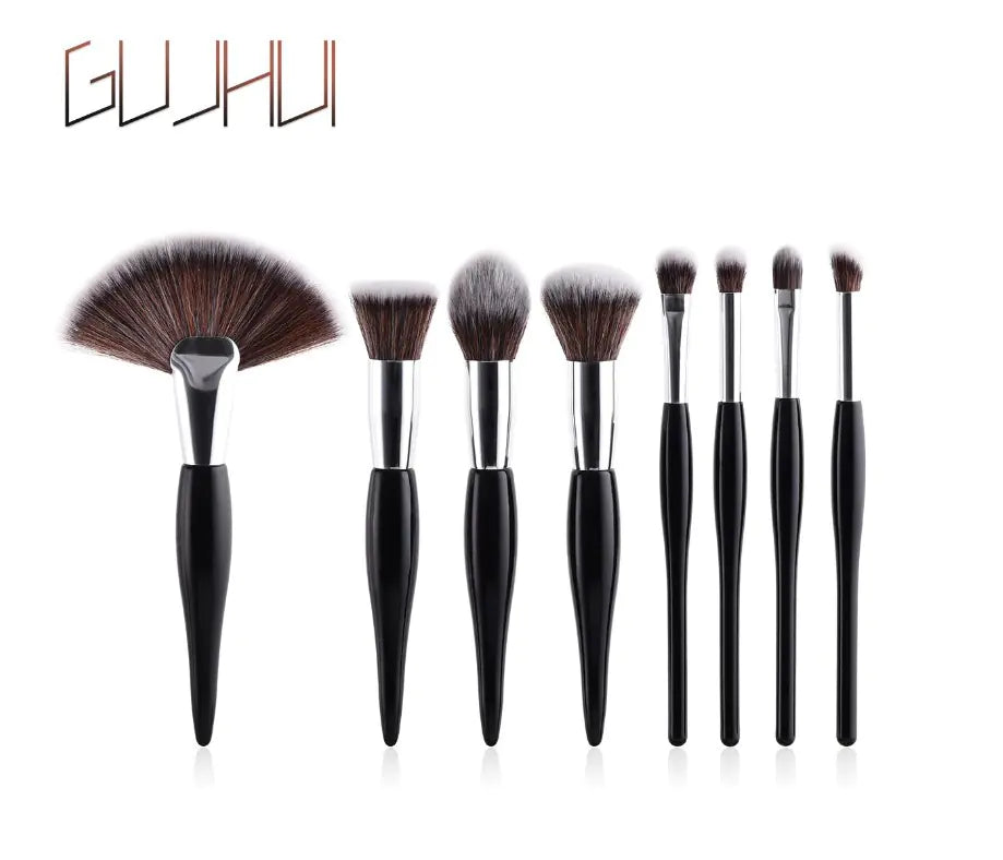 Juego de 8 brochas de maquillaje con mango negro y tubos plateados